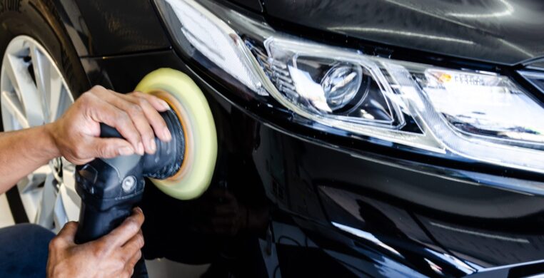 Car polish Car detailing.Man hand holding and polish the car.